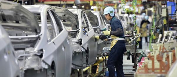 People work on the production line of the Toyota Motor Prius at the company's Tsutsumi plant in Toyota, Aichi prefecture on December 4, 2014 People work on the production line of the Toyota Motor Prius at the company's Tsutsumi plant in Toyota, Aichi prefecture on December 4, 2014 - Sputnik International