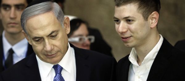 A picture taken on March 18, 2015 shows Israeli Prime Minister Benjamin Netanyahu (L) and his son Yair visiting the Wailing Wall in Jerusalem. The son of Israeli Prime Minister Benjamin Netanyahu faced online criticism on September 9, 2017 after sharing an image on his Facebook page deemed anti-Semitic by critics. A picture taken on March 18, 2015 shows Israeli Prime Minister Benjamin Netanyahu (L) and his son Yair visiting the Wailing Wall in Jerusalem. The son of Israeli Prime Minister Benjamin Netanyahu faced online criticism on September 9, 2017 after sharing an image on his Facebook page deemed anti-Semitic by critics. - Sputnik International