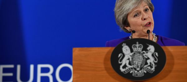 Britain's Prime Minister Theresa May addresses a press conference on the sidelines of a EU summit at the European Council in Brussels on October 18, 2018. Britain's Prime Minister Theresa May addresses a press conference on the sidelines of a EU summit at the European Council in Brussels on October 18, 2018. - Sputnik International