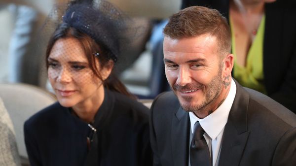 David and Victoria Beckham take their seats in St George's Chapel before the wedding ceremony of Britain's Prince Harry, Duke of Sussex and US actress Meghan Markle in St George's Chapel, Windsor Castle, in Windsor, on May 19, 2018. - Sputnik International