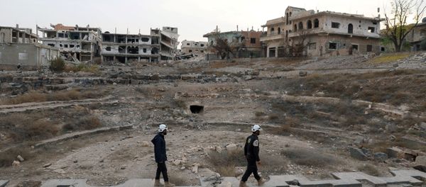 Members of the Civil Defence, also known as the 'White Helmets', are seen inspecting the damage at a Roman ruin site in Daraa, Syria (File) - Sputnik International