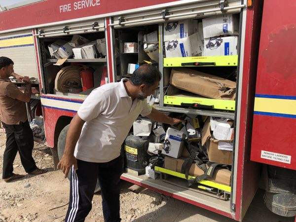 Hassan showing some of the rescue equipment in the local fire engine's compartments. Hassan showing some of the rescue equipment in the local fire engine's compartments. - Sputnik International