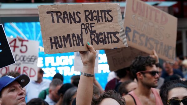 People protest U.S. President Donald Trump's announcement that he plans to reinstate a ban on transgender individuals from serving in any capacity in the U.S. military, in Times Square, in New York City, New York, U.S (File) People protest U.S. President Donald Trump's announcement that he plans to reinstate a ban on transgender individuals from serving in any capacity in the U.S. military, in Times Square, in New York City, New York, U.S (File) - Sputnik International