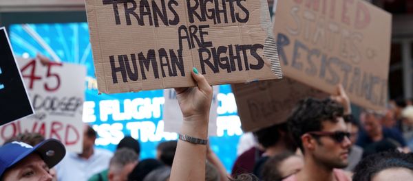 People protest U.S. President Donald Trump's announcement that he plans to reinstate a ban on transgender individuals from serving in any capacity in the U.S. military, in Times Square, in New York City, New York, U.S (File) People protest U.S. President Donald Trump's announcement that he plans to reinstate a ban on transgender individuals from serving in any capacity in the U.S. military, in Times Square, in New York City, New York, U.S (File) - Sputnik International