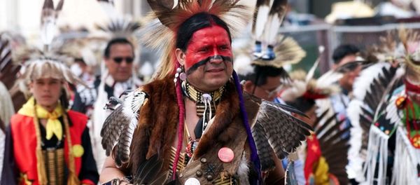 Eddie Two-Clouds, an Apache from Duncan, Okla., marches in the 13th annual Red Earth Festival Parade in downtown Oklahoma City Friday, June 11,1999. - Sputnik International