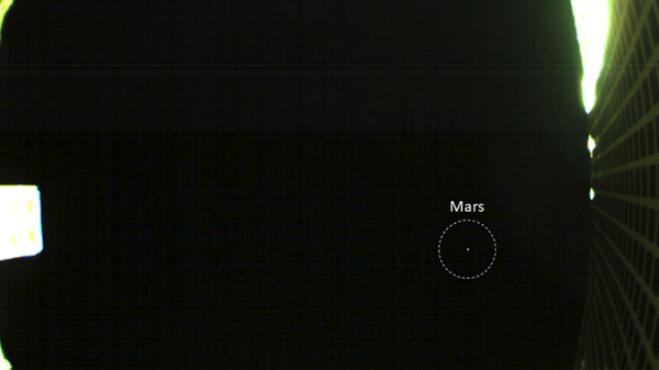 One of NASA's twin MarCO spacecraft took this image of Mars on October 2 -- the first time a CubeSat, a kind of low-cost, briefcase-sized spacecraft -- has done so. - Sputnik International