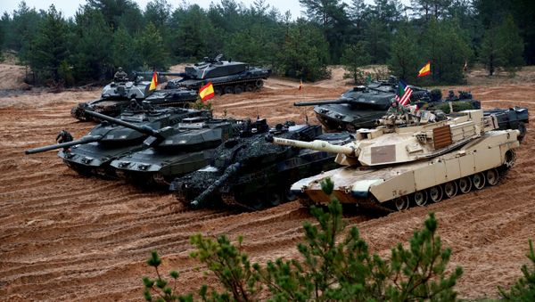 U.S., German, Spanish and Polish troops of the NATO enhanced Forward Presence battle goups with their tanks get ready for the Iron Tomahawk exercise in Adazi, Latvia October 23, 2018 U.S., German, Spanish and Polish troops of the NATO enhanced Forward Presence battle goups with their tanks get ready for the Iron Tomahawk exercise in Adazi, Latvia October 23, 2018 - Sputnik International