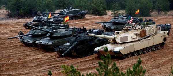 U.S., German, Spanish and Polish troops of the NATO enhanced Forward Presence battle goups with their tanks get ready for the Iron Tomahawk exercise in Adazi, Latvia October 23, 2018 - Sputnik International