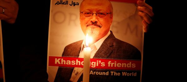 A demonstrator holds a poster with a picture of Saudi journalist Jamal Khashoggi A demonstrator holds a poster with a picture of Saudi journalist Jamal Khashoggi - Sputnik International