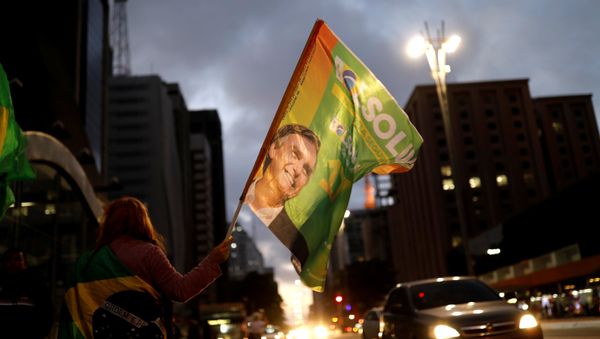 Supporters of Jair Bolsonaro, far-right lawmaker and presidential candidate of the Social Liberal Party (PSL), react during a runoff election in Sao Paulo, Brazil October 28, 2018 Supporters of Jair Bolsonaro, far-right lawmaker and presidential candidate of the Social Liberal Party (PSL), react during a runoff election in Sao Paulo, Brazil October 28, 2018 - Sputnik International