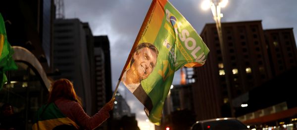 Supporters of Jair Bolsonaro, far-right lawmaker and presidential candidate of the Social Liberal Party (PSL), react during a runoff election in Sao Paulo, Brazil October 28, 2018 Supporters of Jair Bolsonaro, far-right lawmaker and presidential candidate of the Social Liberal Party (PSL), react during a runoff election in Sao Paulo, Brazil October 28, 2018 - Sputnik International