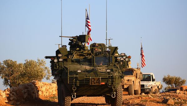 A convoy of US forces armoured vehicles drives near the village of Yalanli, on the western outskirts of the northern Syrian city of Manbij, on March 5, 2017 A convoy of US forces armoured vehicles drives near the village of Yalanli, on the western outskirts of the northern Syrian city of Manbij, on March 5, 2017 - Sputnik International