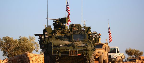 A convoy of US forces armoured vehicles drives near the village of Yalanli, on the western outskirts of the northern Syrian city of Manbij, on March 5, 2017 A convoy of US forces armoured vehicles drives near the village of Yalanli, on the western outskirts of the northern Syrian city of Manbij, on March 5, 2017 - Sputnik International