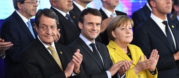 Germany's Chancellor Angela Merkel (2R), France's President Emmanuel Macron (2L), Netherland's Prime minister Mark Rutte (R) and Cyprus' President Nicos Anastasiades (1st-L) attend a ceremony on the Permanent Structure Cooperation (PESCO) on the margin of the first day of a European union summit in Brussels on December 14, 2017. - Sputnik International