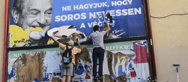 activists of the Egyutt (Together) party tear down an ad by the Hungarian government against George Soros, in Budapest, Hungary activists of the Egyutt (Together) party tear down an ad by the Hungarian government against George Soros, in Budapest, Hungary - Sputnik International