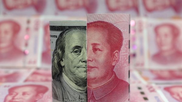 A Benjamin Franklin U.S. 100-dollar banknote and a Chinese 100-yuan banknote depicting late Chinese chairman Mao Zedong are seen in a picture illustration taken January 21, 2016 A Benjamin Franklin U.S. 100-dollar banknote and a Chinese 100-yuan banknote depicting late Chinese chairman Mao Zedong are seen in a picture illustration taken January 21, 2016 - Sputnik International