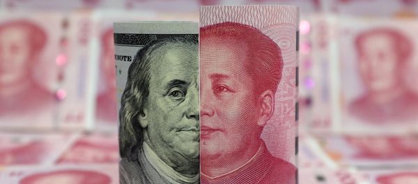 A Benjamin Franklin U.S. 100-dollar banknote and a Chinese 100-yuan banknote depicting late Chinese chairman Mao Zedong are seen in a picture illustration taken January 21, 2016 - Sputnik International