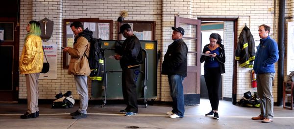 Voters wait to cast their ballots at a fire station serving as a voting place for the midterm election in Detroit Voters wait to cast their ballots at a fire station serving as a voting place for the midterm election in Detroit - Sputnik International