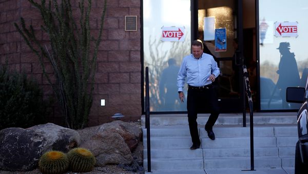 A man leaves the Carefree Town Council building after voting at a polling station in the mid-term general elections in Carefree - Sputnik International