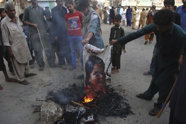 Pakistani protesters burn a poster image of Christian woman Asia Bibi, who has spent eight-years on death row accused of blasphemy and acquitted by a Supreme Court, in Hyderabad, Pakistan, Thursday, Nov. 1, 2018 Pakistani protesters burn a poster image of Christian woman Asia Bibi, who has spent eight-years on death row accused of blasphemy and acquitted by a Supreme Court, in Hyderabad, Pakistan, Thursday, Nov. 1, 2018 - Sputnik International