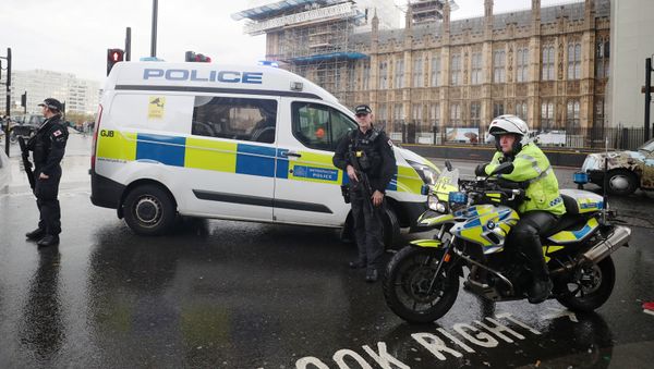 Armed and motorcycle police officers stand next to the Houses of Parliament after an area of the Victoria Embankment was cordoned off, in London, Britain, October 17, 2018. Armed and motorcycle police officers stand next to the Houses of Parliament after an area of the Victoria Embankment was cordoned off, in London, Britain, October 17, 2018. - Sputnik International