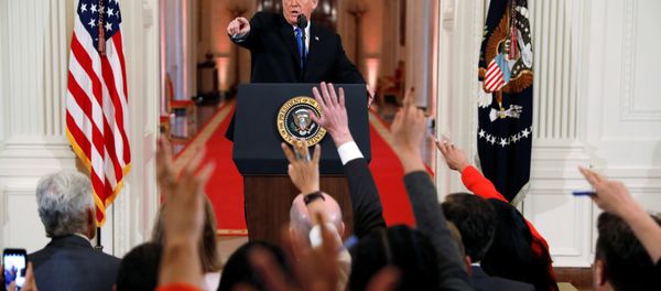 U.S. President Donald Trump points to a questioner while taking questions during a news conference following Tuesday's midterm congressional elections at the White House in Washington, U.S., November 7, 2018 - Sputnik International
