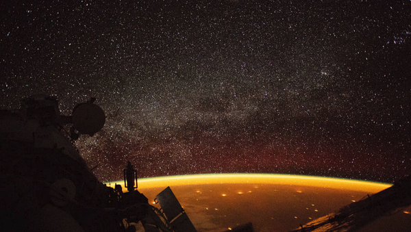 Astronaut aboard the International Space Station captures image of orange airglow enveloping Earth Astronaut aboard the International Space Station captures image of orange airglow enveloping Earth - Sputnik International