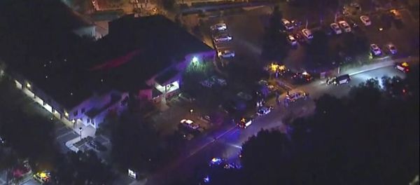 In this image made from aerial video, police vehicles line a road in the vicinity of a shooting in Thousand Oaks, California, early Thursday, Nov. 8, 2018 - Sputnik International