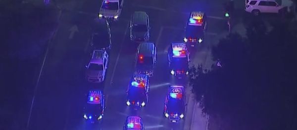 In this image made from aerial video, police vehicles block an intersection in the vicinity of a shooting in Thousand Oaks, California, early Thursday, Nov. 8, 2018 In this image made from aerial video, police vehicles block an intersection in the vicinity of a shooting in Thousand Oaks, California, early Thursday, Nov. 8, 2018 - Sputnik International