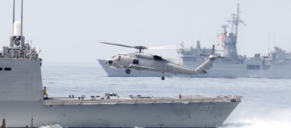 A Taiwan Navy S70 helicopter takes off from the stern of a Perry-class frigate during a navy exercise in the bound of Suao naval station in Yilan County, northeast of Taiwan, Friday, April 13, 2018 A Taiwan Navy S70 helicopter takes off from the stern of a Perry-class frigate during a navy exercise in the bound of Suao naval station in Yilan County, northeast of Taiwan, Friday, April 13, 2018 - Sputnik International