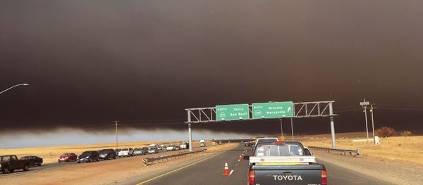 Smoke from the Camp Fire, burning in the Feather River Canyon near Paradise, Calif., darkens the sky as seen from Highway 99 near Marysville, Calif., Thursday, Nov. 8, 2018. - Sputnik International