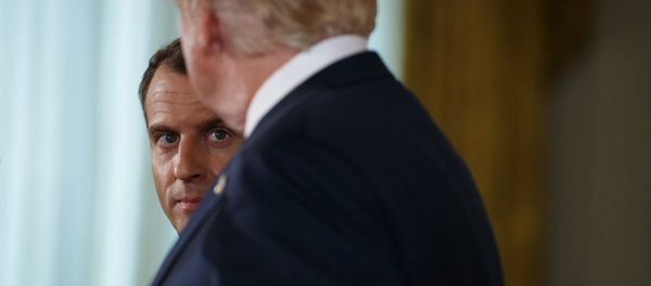 French President Emmanuel Macron listens as President Donald Trump speaks during a news conference in the East Room of the White House, Tuesday, April 24, 2018, in Washington. (AP Photo/Evan Vucci) - Sputnik International