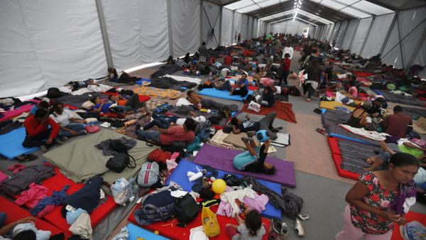 Central American migrants, part of a caravan hoping to reach the U.S. gets settled in a shelter at the Jesus Martinez stadium, in Mexico City, Monday, Nov. 5, 2018. Thousands of Central American migrants have arrived at the stadium, still hundreds of miles away from their goal of reaching the U.S. a day before midterm elections in which they unwittingly became a central issue. Central American migrants, part of a caravan hoping to reach the U.S. gets settled in a shelter at the Jesus Martinez stadium, in Mexico City, Monday, Nov. 5, 2018. Thousands of Central American migrants have arrived at the stadium, still hundreds of miles away from their goal of reaching the U.S. a day before midterm elections in which they unwittingly became a central issue. - Sputnik International