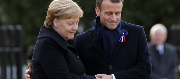 French President Emmanuel Macron, right, holds the hands of German Chancellor Angela Merkel during a ceremony in Compiegne, north of Paris, Saturday, Nov. 10, 2018. French President Emmanuel Macron, right, holds the hands of German Chancellor Angela Merkel during a ceremony in Compiegne, north of Paris, Saturday, Nov. 10, 2018. - Sputnik International