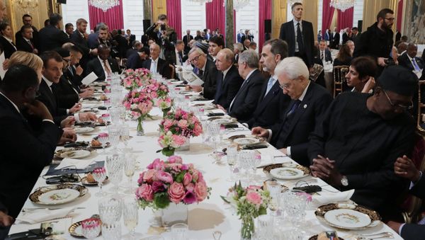 Russian President Vladimir Putin during a working lunch hosted by French President Emmanuel Macron for heads of state and government invited to attend events to mark 100 years since the end of WWI. - Sputnik International