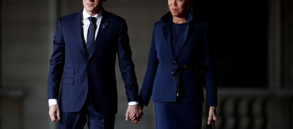 French President Emmanuel Macron and his wife Brigitte Macron arrive to attend a dinner at the Orsay Museum as part of the commemoration ceremony for Armistice Day, 100 years after the end of the First World War, in Paris - Sputnik International