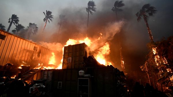 A home is engulfed in flames during the Woolsey Fire in Malibu, California - Sputnik International