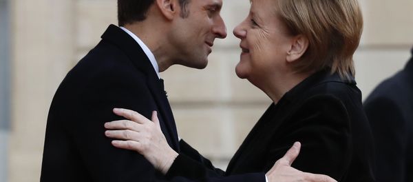 French President Emmanuel Macron hugs German Chancellor Angela Merkel in the courtyard of the Elysee Palace. File photo French President Emmanuel Macron hugs German Chancellor Angela Merkel in the courtyard of the Elysee Palace. File photo - Sputnik International