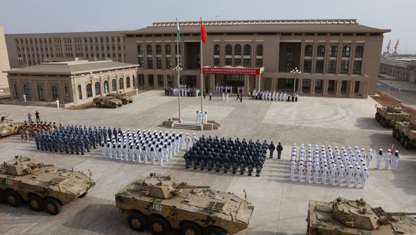 This photo taken on August 1, 2017 shows Chinese People's Liberation Army personnel attending the opening ceremony of China's new military base in Djibouti This photo taken on August 1, 2017 shows Chinese People's Liberation Army personnel attending the opening ceremony of China's new military base in Djibouti - Sputnik International