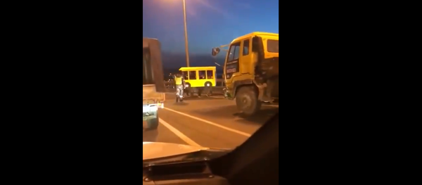 Four individuals disguise themselves in a cardboard bus to cross Russia's car-only bridge in Vladivostok Four individuals disguise themselves in a cardboard bus to cross Russia's car-only bridge in Vladivostok - Sputnik International