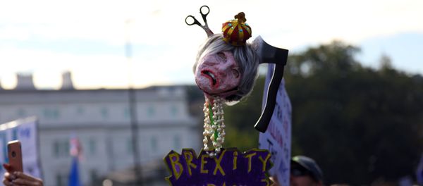 Protesters participating in an anti-Brexit demonstration, carry an effigy of Britain's Prime Minister Theresa May, as they march through central London, Britain October 20, 2018 Protesters participating in an anti-Brexit demonstration, carry an effigy of Britain's Prime Minister Theresa May, as they march through central London, Britain October 20, 2018 - Sputnik International