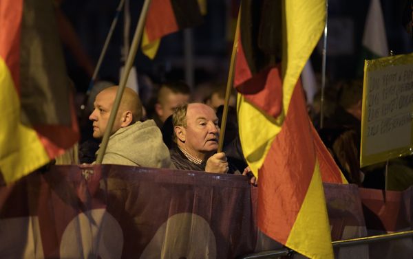 Demonstrators with German flags attend a protest against the visit of German Chancellor Angela Merkel at the East German city Chemnitz on Friday, Nov. 16, 2018. Demonstrators with German flags attend a protest against the visit of German Chancellor Angela Merkel at the East German city Chemnitz on Friday, Nov. 16, 2018. - Sputnik International