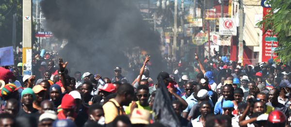 Demonstrators march during a protest demanding accountability from politicians for allegedly squandering billions of dollars in proceeds from Venezuela’s discounted PetroCaribe oil program in the streets of Port-au-Prince, on November 18, 2018, Investigations by the Haitian Senate in 2016 and 2017 concluded that nearly $2 billion from a Venezuelan aid program called Petrocaribe were misused. Through Petrocaribe, Venezuela for years supplied Haiti and other Caribbean and Central American countries with oil at cut-rate prices and on easy credit terms. Demonstrators march during a protest demanding accountability from politicians for allegedly squandering billions of dollars in proceeds from Venezuela’s discounted PetroCaribe oil program in the streets of Port-au-Prince, on November 18, 2018, Investigations by the Haitian Senate in 2016 and 2017 concluded that nearly $2 billion from a Venezuelan aid program called Petrocaribe were misused. Through Petrocaribe, Venezuela for years supplied Haiti and other Caribbean and Central American countries with oil at cut-rate prices and on easy credit terms. - Sputnik International