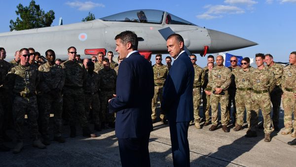 British Defence Minister Gavin Williamson (L) and his Romanian counterpart Mihai Fifor (R), meet with the British pilots and technical staff serving the four British Air Force Typhoons and the Romanian military personnel at Mihail Kogalniceanu 57 Air Base near Constanta, Romania on August 2, 2018. - Sputnik International