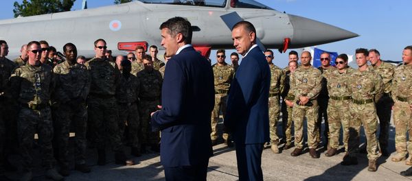 British Defence Minister Gavin Williamson (L) and his Romanian counterpart Mihai Fifor (R), meet with the British pilots and technical staff serving the four British Air Force Typhoons and the Romanian military personnel at Mihail Kogalniceanu 57 Air Base near Constanta, Romania on August 2, 2018. British Defence Minister Gavin Williamson (L) and his Romanian counterpart Mihai Fifor (R), meet with the British pilots and technical staff serving the four British Air Force Typhoons and the Romanian military personnel at Mihail Kogalniceanu 57 Air Base near Constanta, Romania on August 2, 2018. - Sputnik International