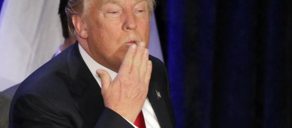 Republican presidential candidate, businessman Donald Trump blows a kiss after speaking at his caucus night rally, Monday, Feb. 1, 2016, in West Des Moines, Iowa - Sputnik International