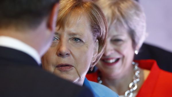 German Chancellor Angela Merkel, left, and British Prime Minister Theresa May wait for the beginning of the plenary session of the informal EU summit in Salzburg, Austria, Thursday, Sept. 20, 2018. German Chancellor Angela Merkel, left, and British Prime Minister Theresa May wait for the beginning of the plenary session of the informal EU summit in Salzburg, Austria, Thursday, Sept. 20, 2018. - Sputnik International