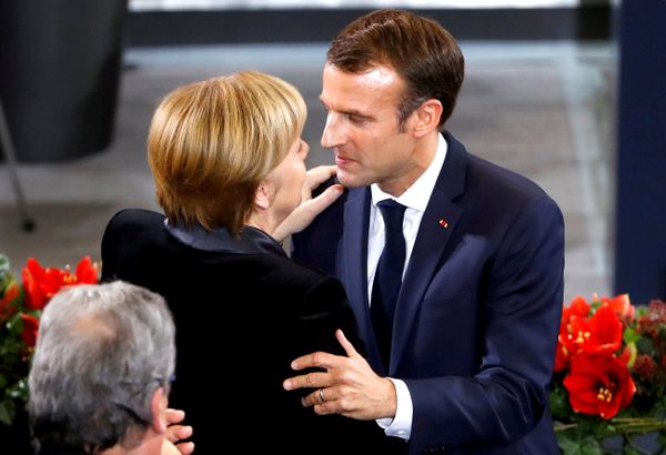French President Emmanuel Macron hugs German Chancellor Angela Merkel after giving a speech during a ceremony at the Bundestag French President Emmanuel Macron hugs German Chancellor Angela Merkel after giving a speech during a ceremony at the Bundestag - Sputnik International