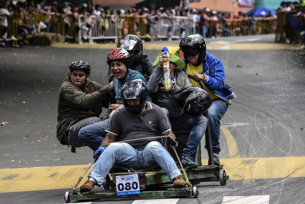 Participants descend a hill in home-made vehicles during the 29th Car Festival in Medellin, Antioquia department, Colombia Participants descend a hill in home-made vehicles during the 29th Car Festival in Medellin, Antioquia department, Colombia - Sputnik International