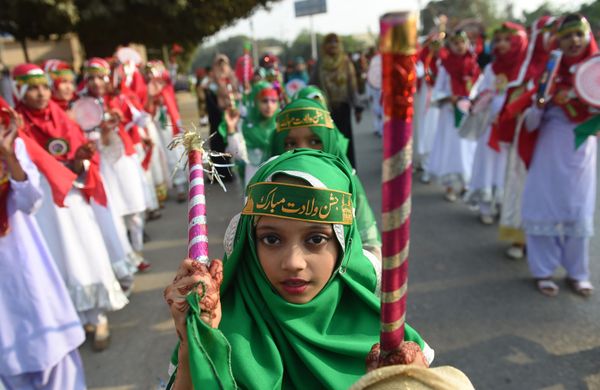 Pakistani Muslim girl takes part in a rally during Eid Milad-un-Nabi, which marks the anniversary of the birth of Prophet Muhammad, in Karachi Pakistani Muslim girl takes part in a rally during Eid Milad-un-Nabi, which marks the anniversary of the birth of Prophet Muhammad, in Karachi - Sputnik International